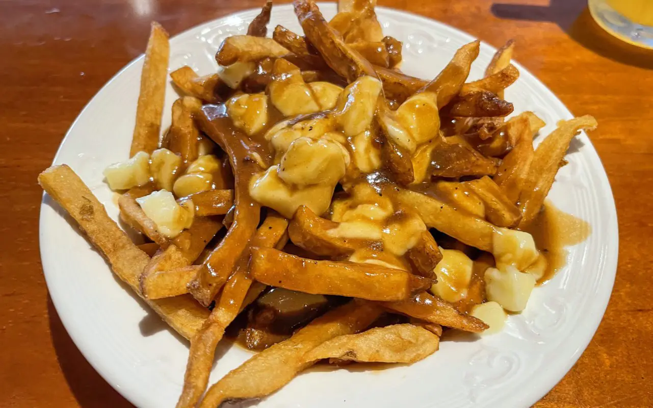 Poutine on a wood table | st jacobs