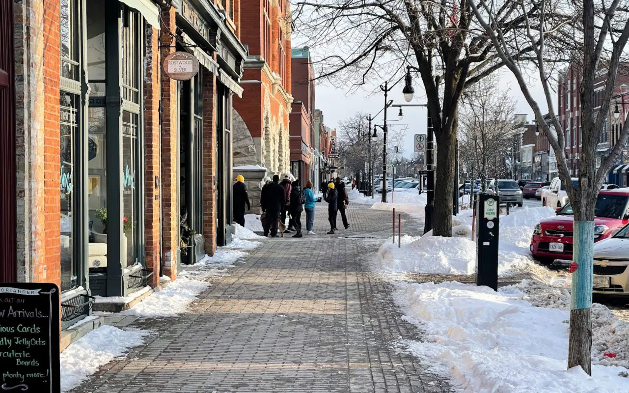 people standing on the streets of Collingwood in the winter | Fun Things To Do In Collingwood Ontario | Blue Mountain & Collingwood Attractions