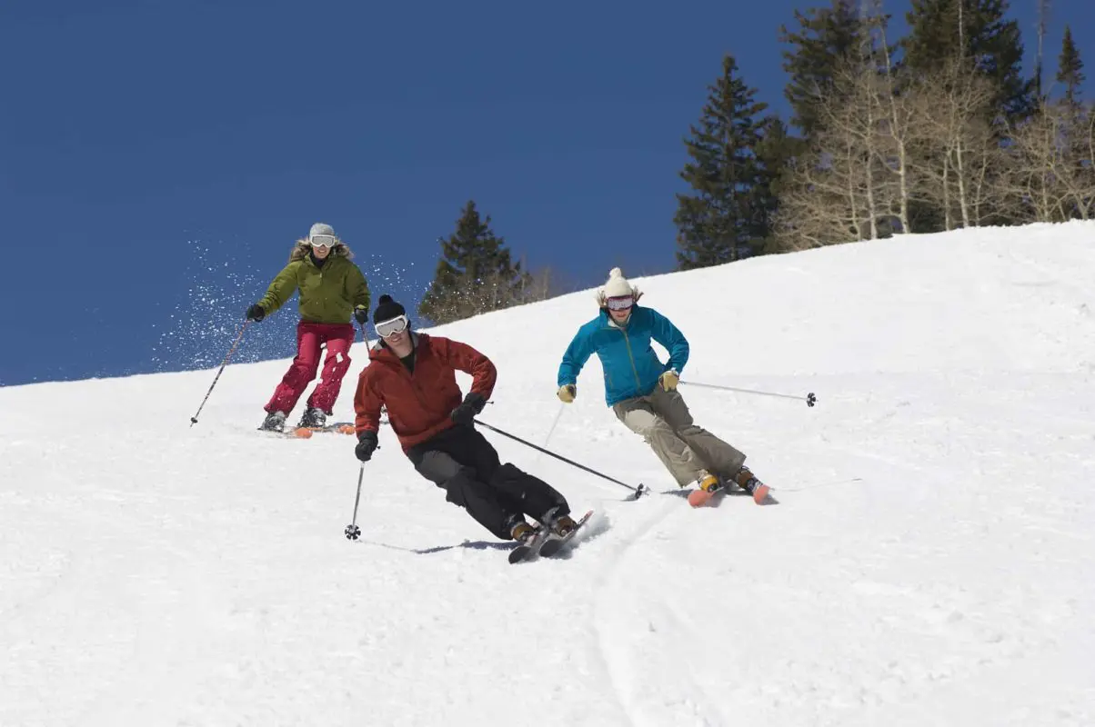three people skiing down a hill | best ski hills in ontario