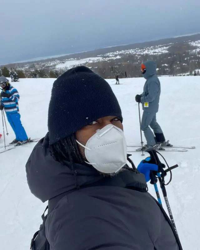 A woman taking a selfie on a ski hill | ski hills