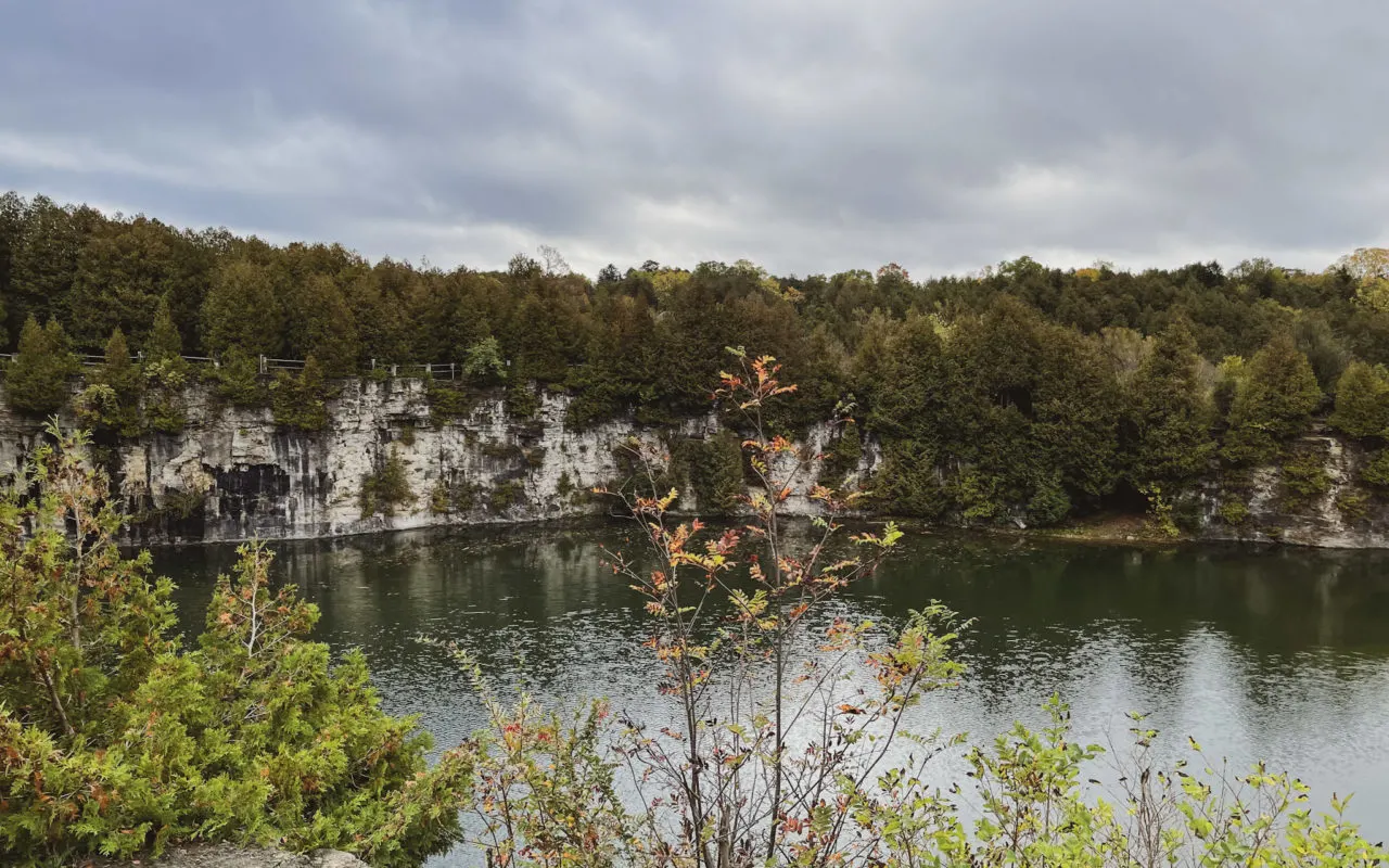 lake surrounded by large rocky cliffs and forest | things to do in elora