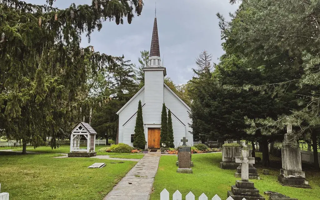 small white church surrounded by a cemetery | brantford canada points of interest