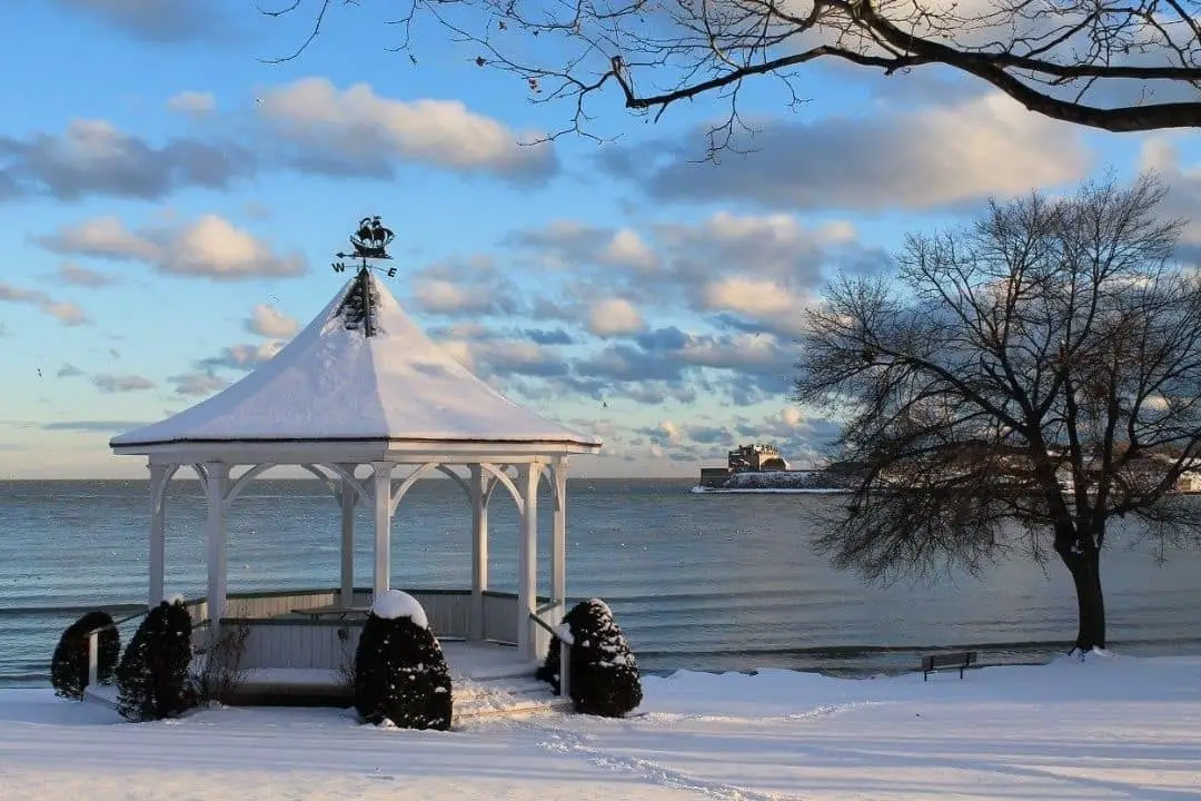 Small gazebo by the water, covered in snow | christmas getaways in ontario