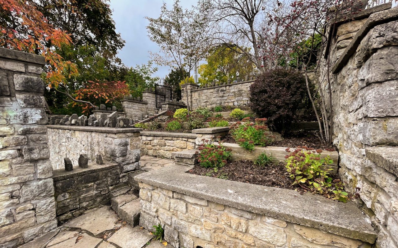stone pathway surrounded by raised stone gardens | downtown fergus
